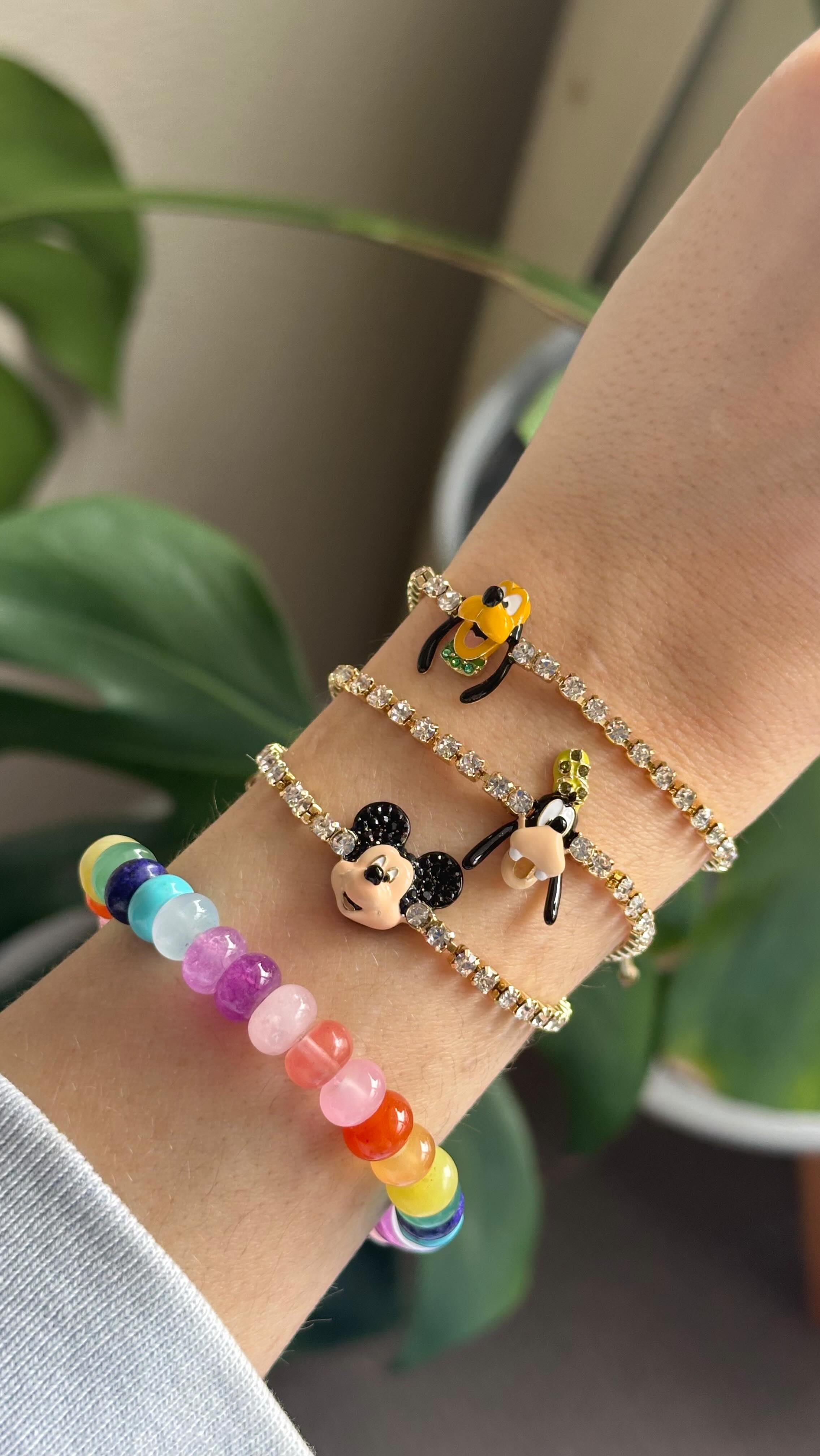 Instagram post by @lohegna for BaubleBar. Caption reads: A happy summer stack 🐭✨🌈 there are still a few....