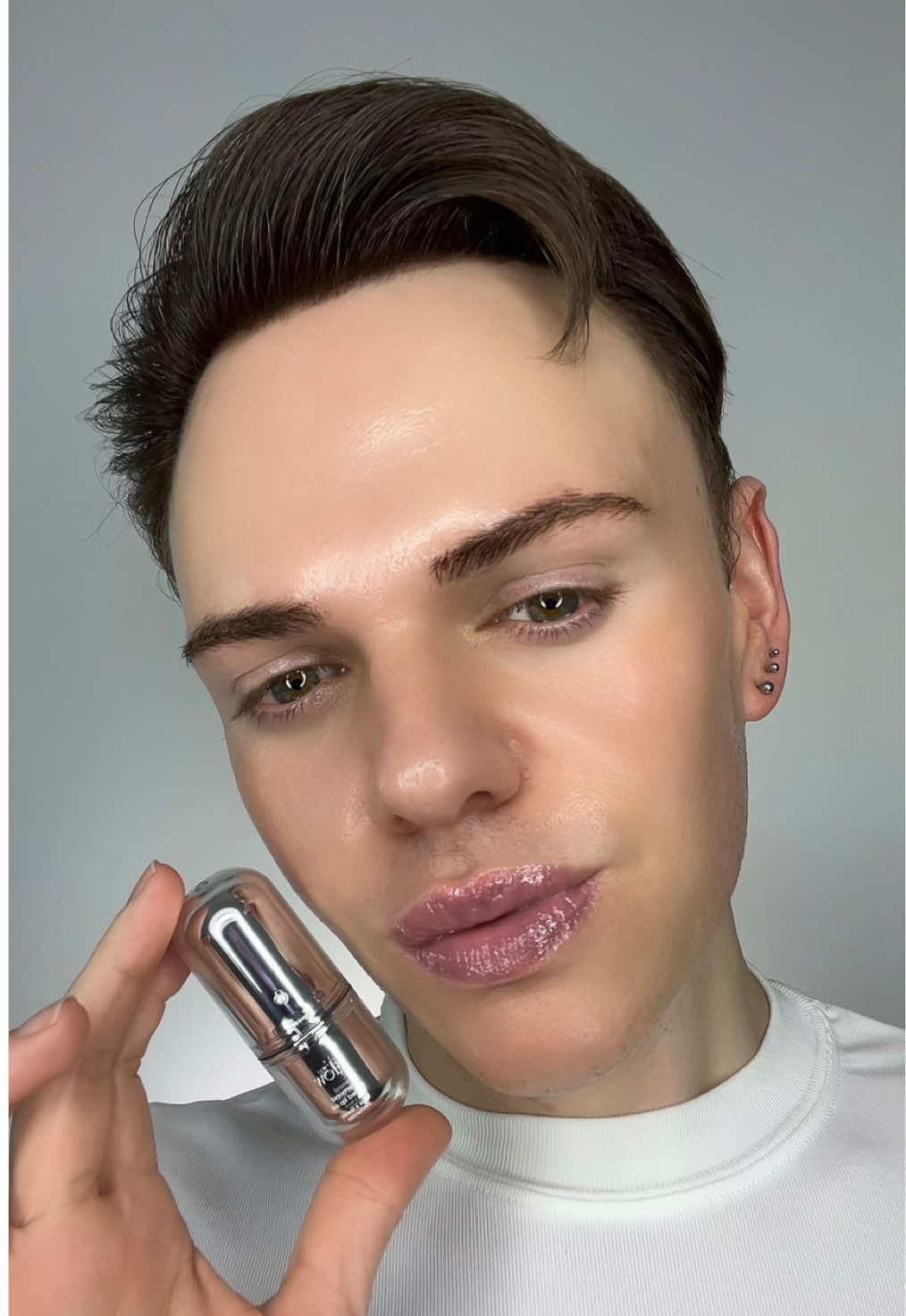 TikTok post by @joshwastjames for Glow Is Here. Caption reads: glow’s diamond tinted lip oil is now available!....