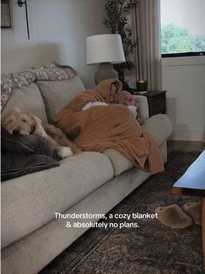 TikTok post by @blackbarndo_onthehill for Sand Cloud. Caption reads: [...] beside me, and wrapped up in my cozy Sand....