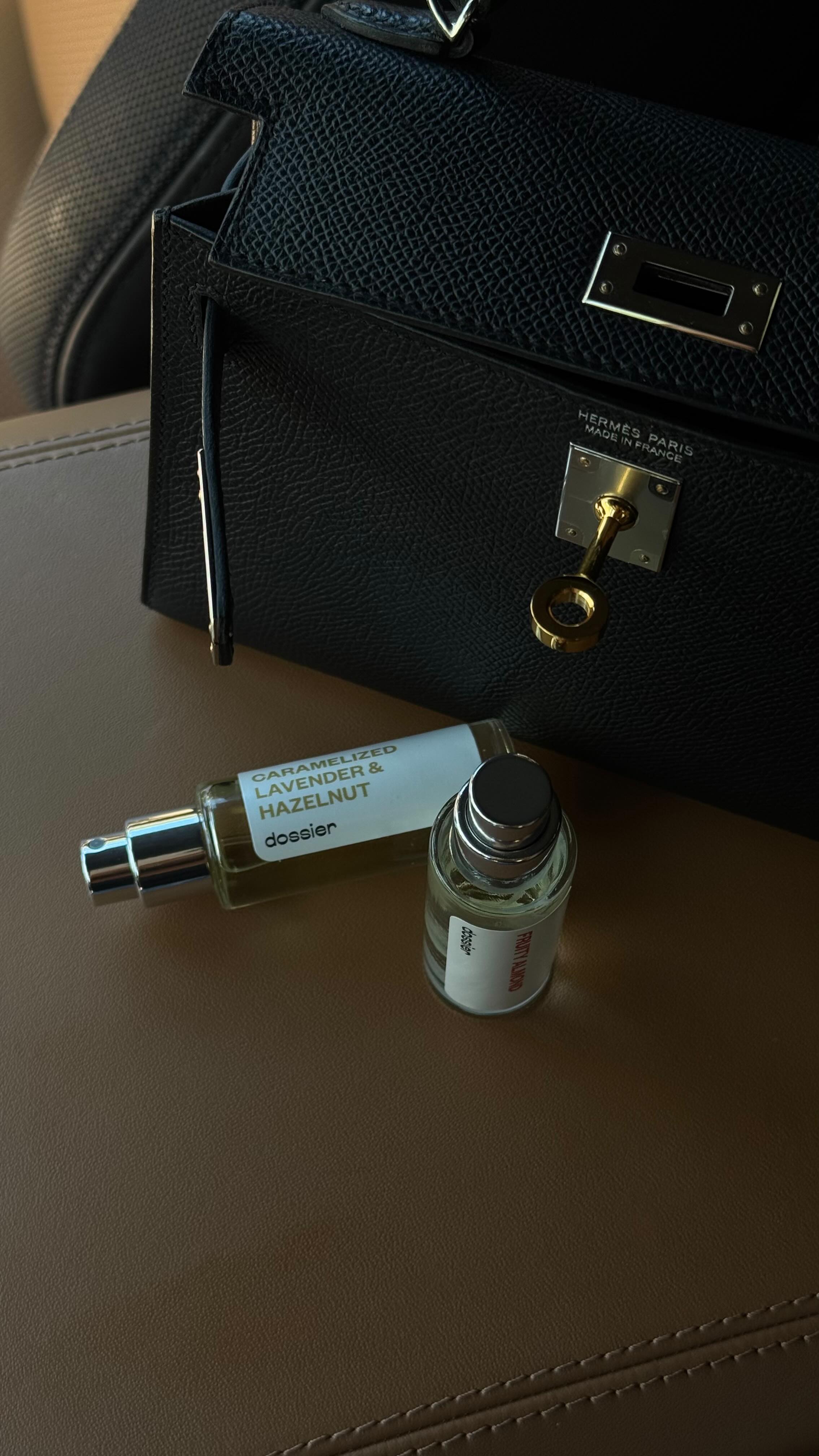 Instagram post by @sivanayla for Dossier. Caption reads: A micro bag non-negotiable: perfume 👜....
