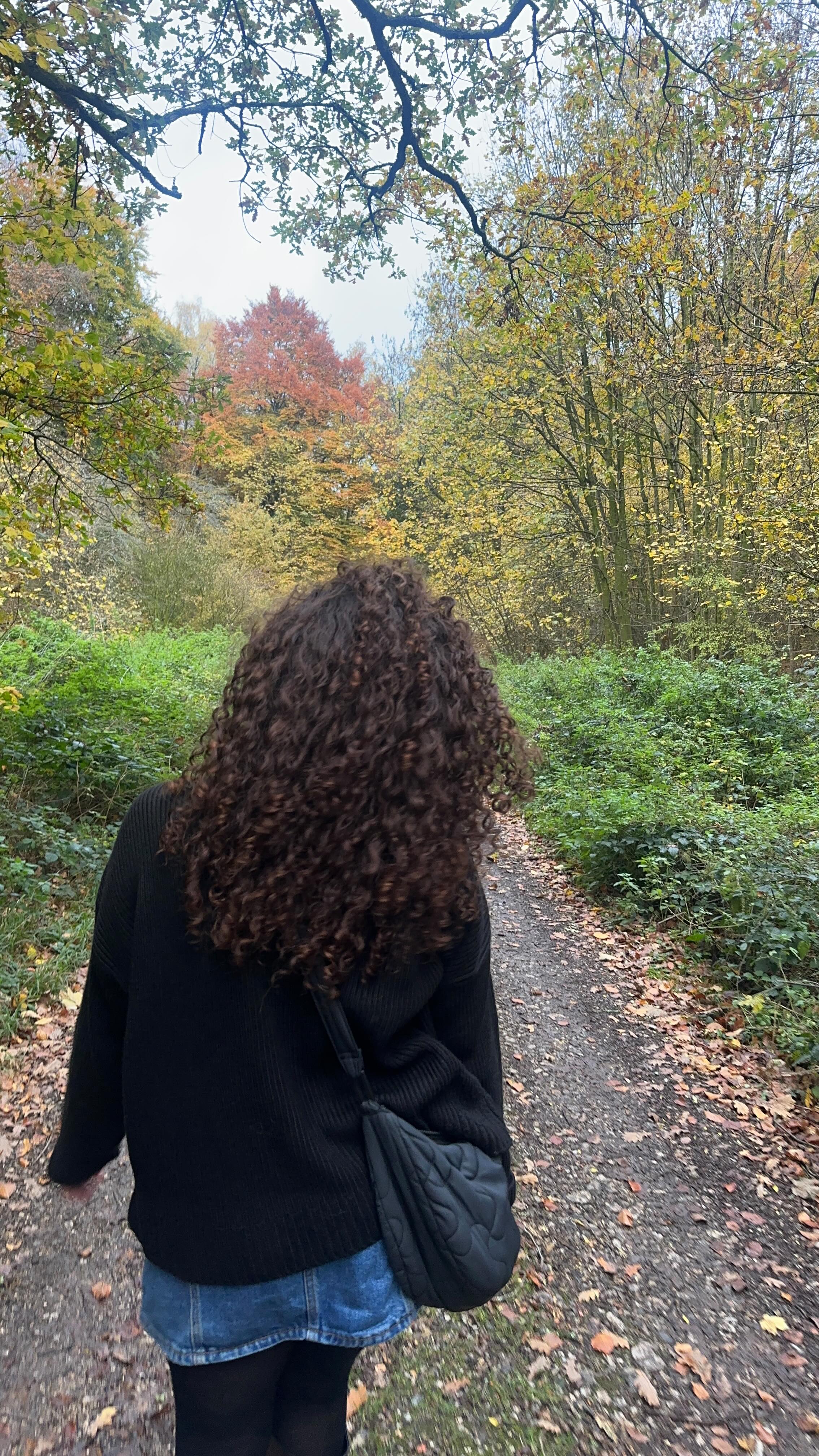 Instagram post by @sophiemariecurly for UMBERTO GIANNINI. Caption reads: curly hair has never been “just hair” this sound....