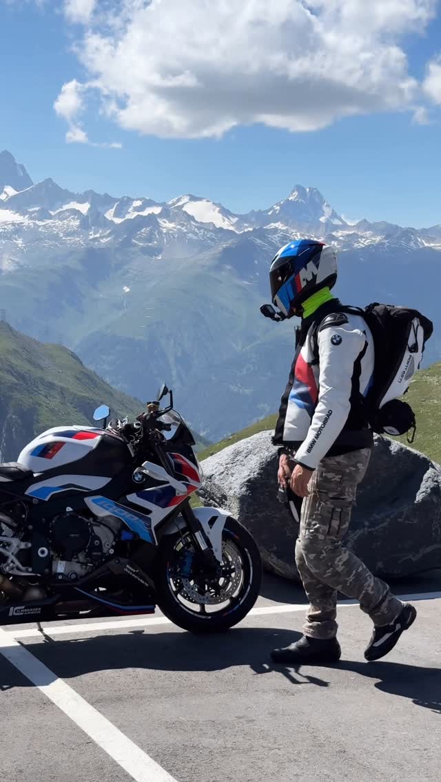 Instagram post by @motohunter_denchik for BMW Motorrad. Caption reads: Go to Trend🤩 Alps Switzerland🇨🇭 #trend #bmw....