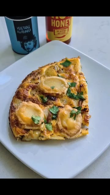 Instagram post by @scrimpy_scottie for JD’s Hot Honey. Caption reads: 🧀 Honey Goats Cheese Frittata 🧀 Ad @jdshothoney....