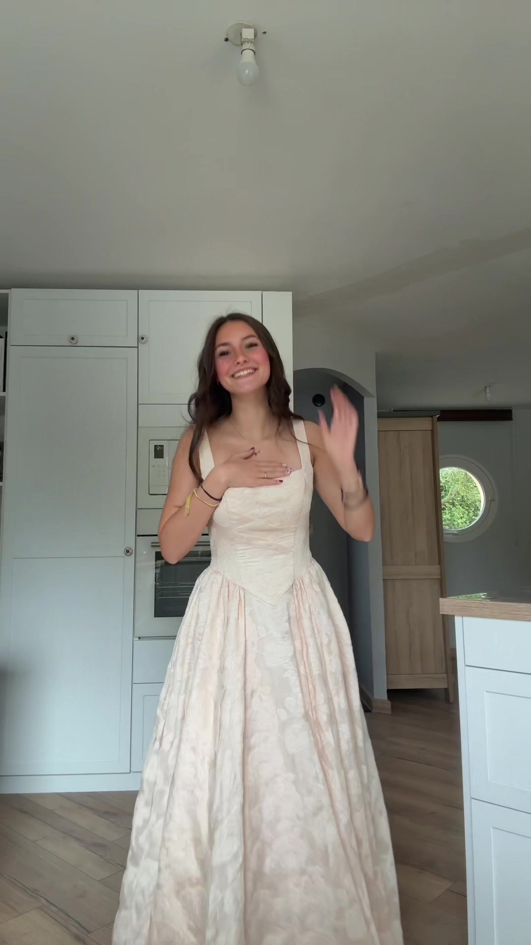 TikTok post by @jadou_2528 for Azazie. Caption reads: ROBE LONGUE CREME BRIONNE@Azazie #pourtoi #fyp....