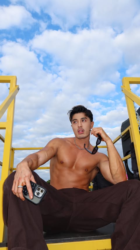 Instagram post by @ethanxofficial for Grindr. Caption reads: Famous like the @grindr bus #GrindrPartner....