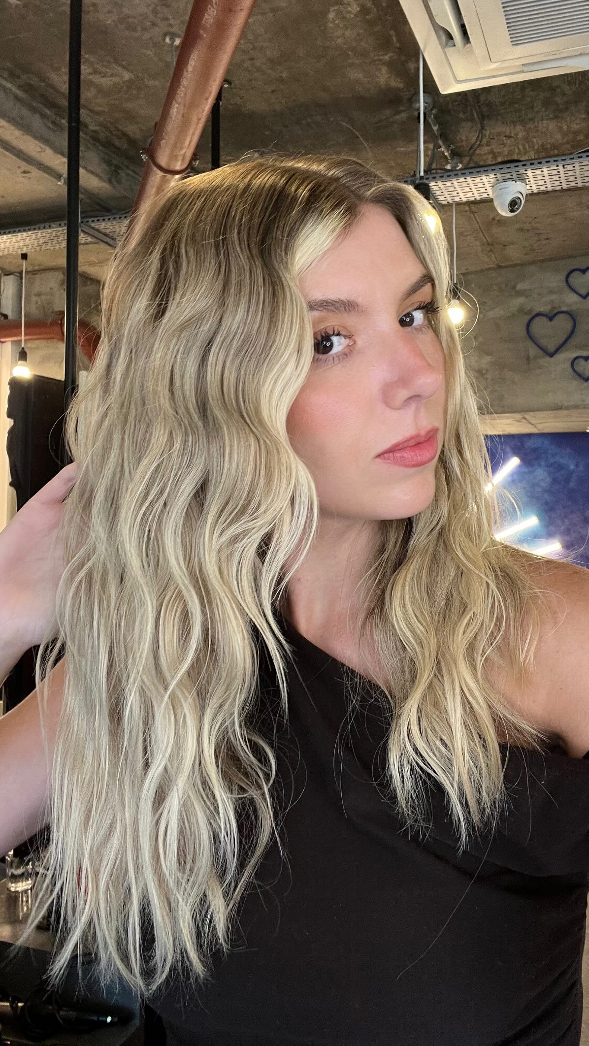 Instagram post by @whatlydialikes for Ghd Hair. Caption reads: Summer waves just hit different with this tool....