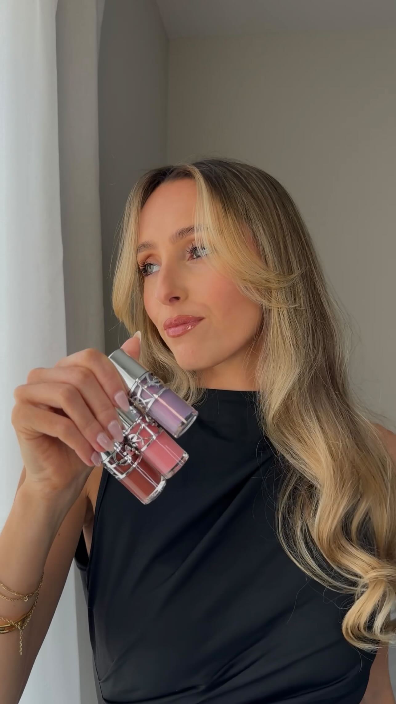 Instagram post by an influencer for YSL Beauty. Caption reads: [...] plumping lip oil glosses @yslbeauty Shades....