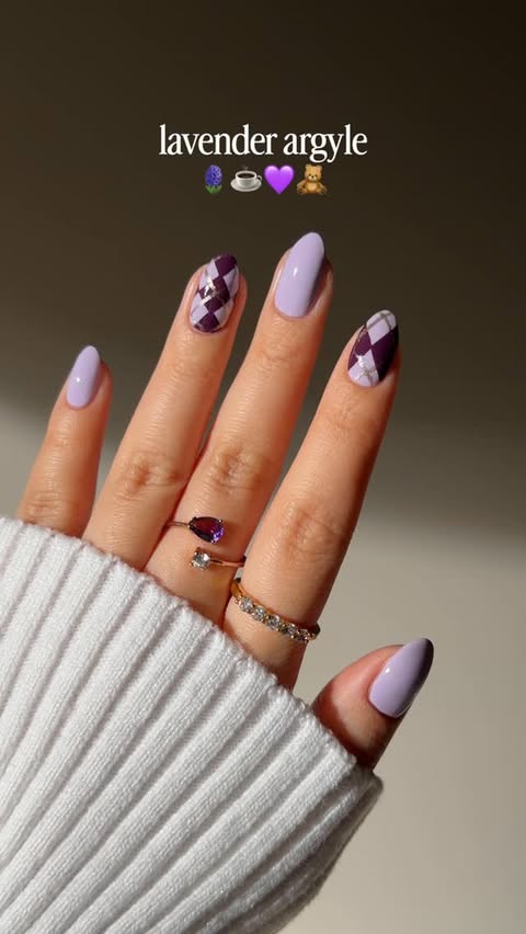 Instagram post by @bycheznails for ella+mila. Caption reads: cozy lavender argyle nails 🪻💜 with @ellamila •ad....
