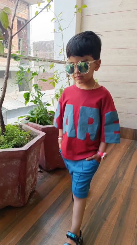 Instagram post by @tavish_and_mommy for RARE RABBIT. Caption reads: Rare Ones matches cool kid energy. Style and ease....
