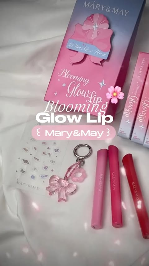 Instagram post by @yoooo._ha for Mary&May. Caption reads: Blooming glow on my lips 🌸 바른 순간 퍼지는 생기 + 유리알 글로우....