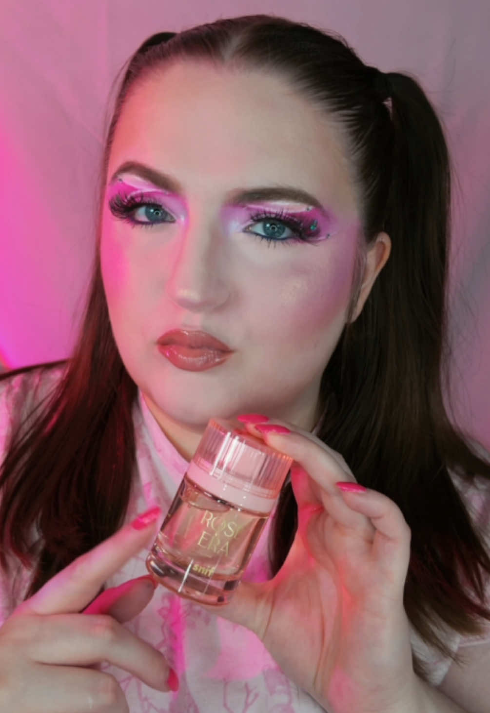 TikTok post by @makeupbyliz._ for Snif. Caption reads: the perfect floral scent for spring 🌸💕✨ @Snif x....