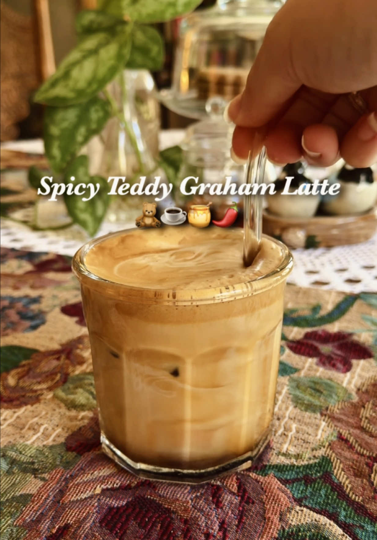 TikTok post by @thethriftwitch for Mike's Hot Honey. Caption reads: [...] #CoffeeRecipes #TeddyGrahamLatte....