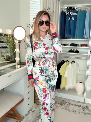 TikTok post by @aburgos02 for Newbella Fashion. Caption reads: #2pieceset #floralpants #floralshirt #twopieceset....
