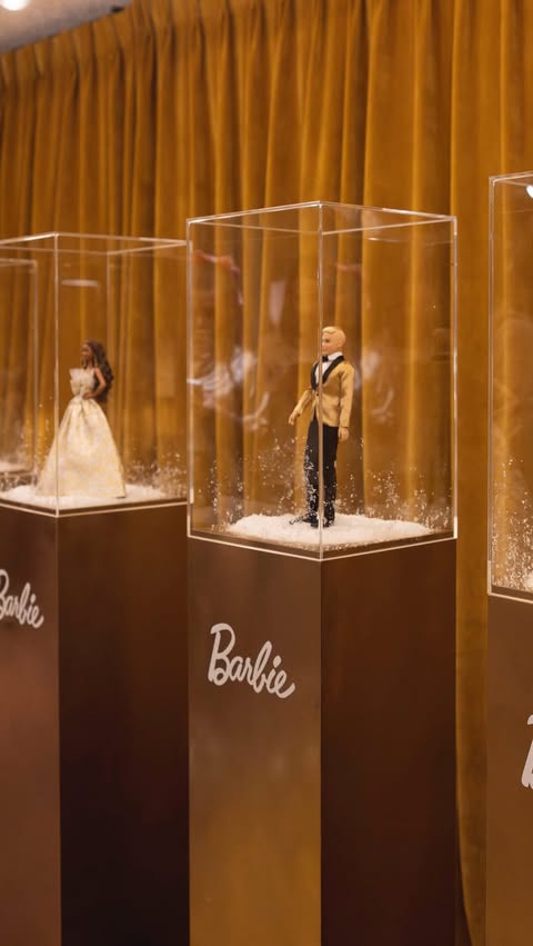 Instagram post by @unboxwithgemmasummer for Barbie. Caption reads: The moment the 2025 Holiday Barbie was revealed in....