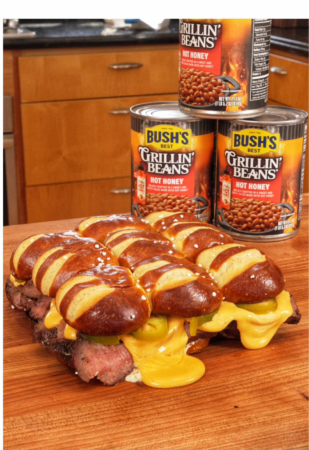 TikTok post by @rafifronz for Mike's Hot Honey. Caption reads: Unreal tailgate combo using @Bush’s Beans ....