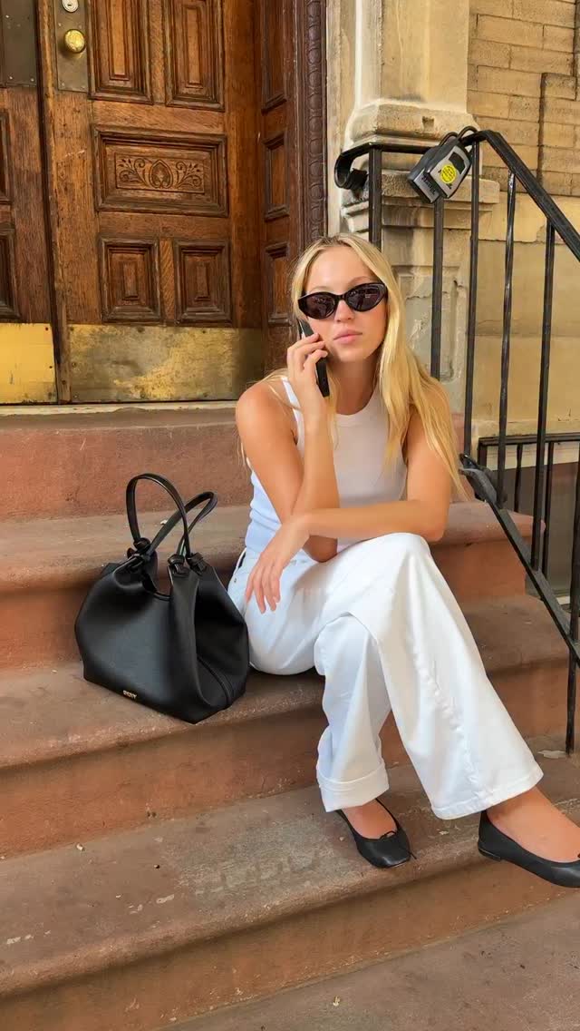 Instagram post by @lilamoss for DKNY. Caption reads: A New York summer stroll @dkny #dknypartner.