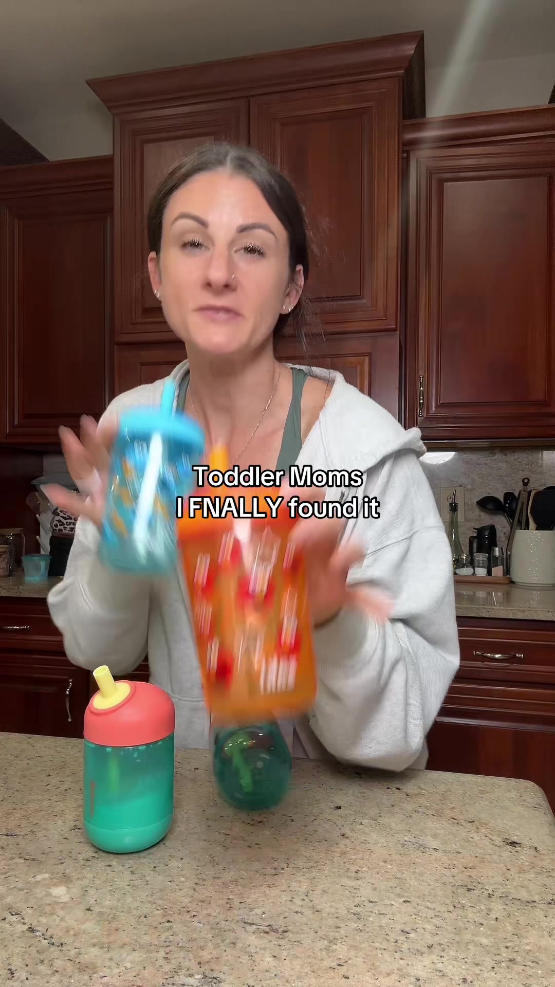 TikTok post by @lisam_lifestyle for Munchkin. Caption reads: [...] leakrpoof cups that do what they say....