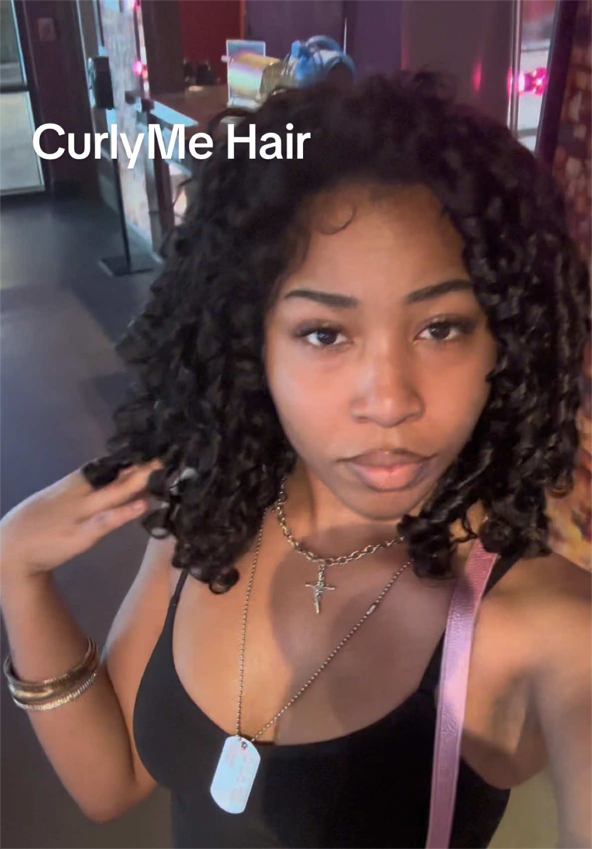 TikTok post by @dd.mona for CurlyMe Hair. Caption reads: indian curly for the win 😍 @CurlyMe Hair @CurlyMe....