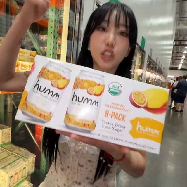 Instagram post by @allcapskat for Humm Kombucha. Caption reads: 🚨🚨HUMM ORGANIC KOMBUCHA IS NOW AVAILABLE AT....