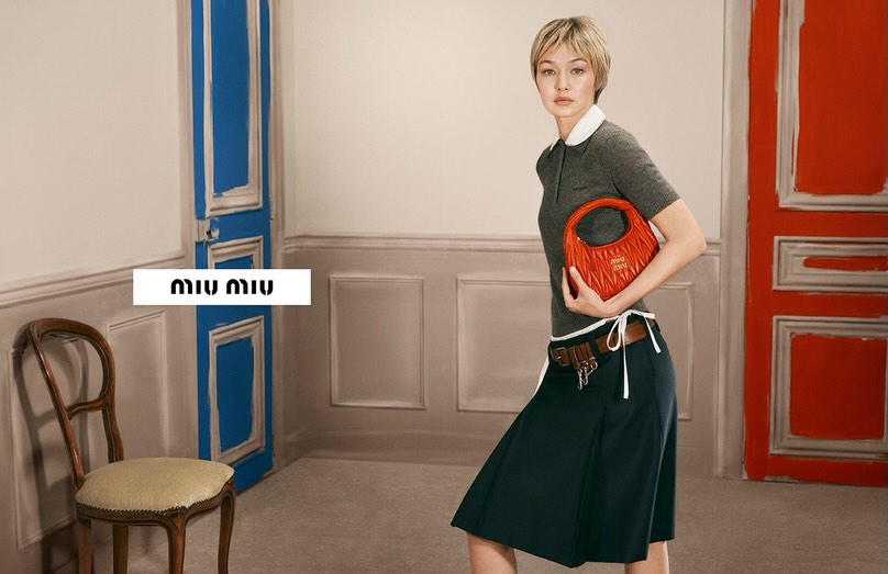Instagram post by @gigihadid for Miu Miu. Caption reads: miuccia, meisel, and me. 💌 @miumiu ‘26 leather....