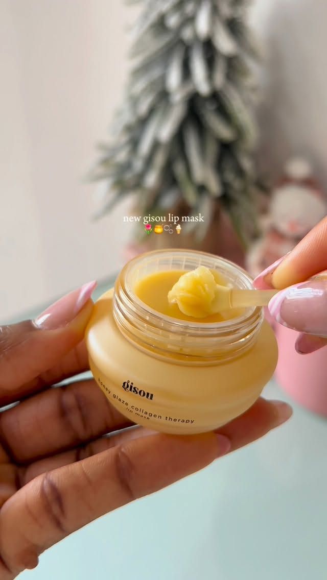 Instagram post by @lifethru.angie for Gisou. Caption reads: new honey glazed lip therapy mask by @gisou 
I....