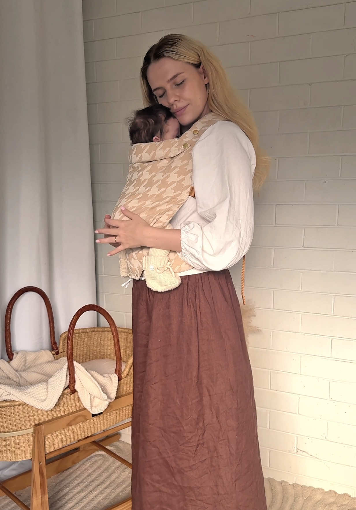 TikTok post by @celestedrummond for Chekoh. Caption reads: [...] wonder babywearing just feels right 💛....