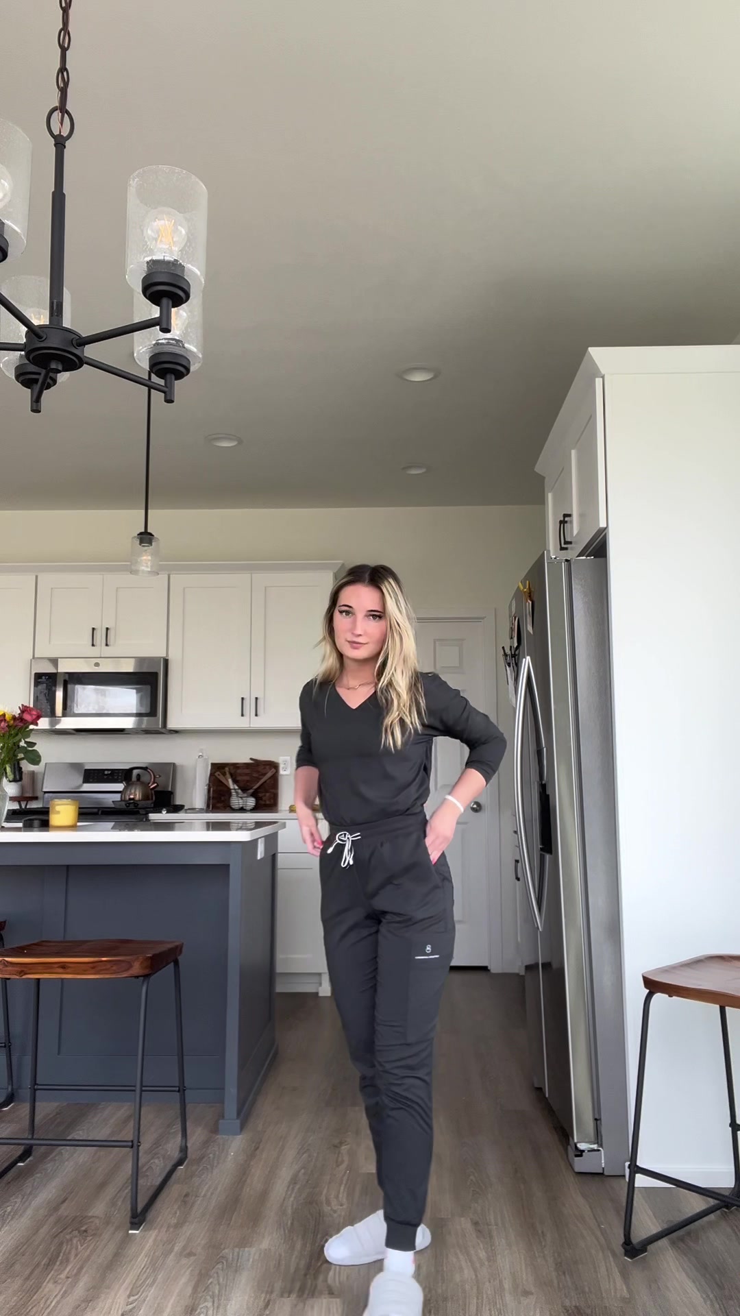 TikTok post by @jlebbbbbb for DOLAN Scrubs. Caption reads: I’ve partnered with @DOLAN Scrubs for nurses week....