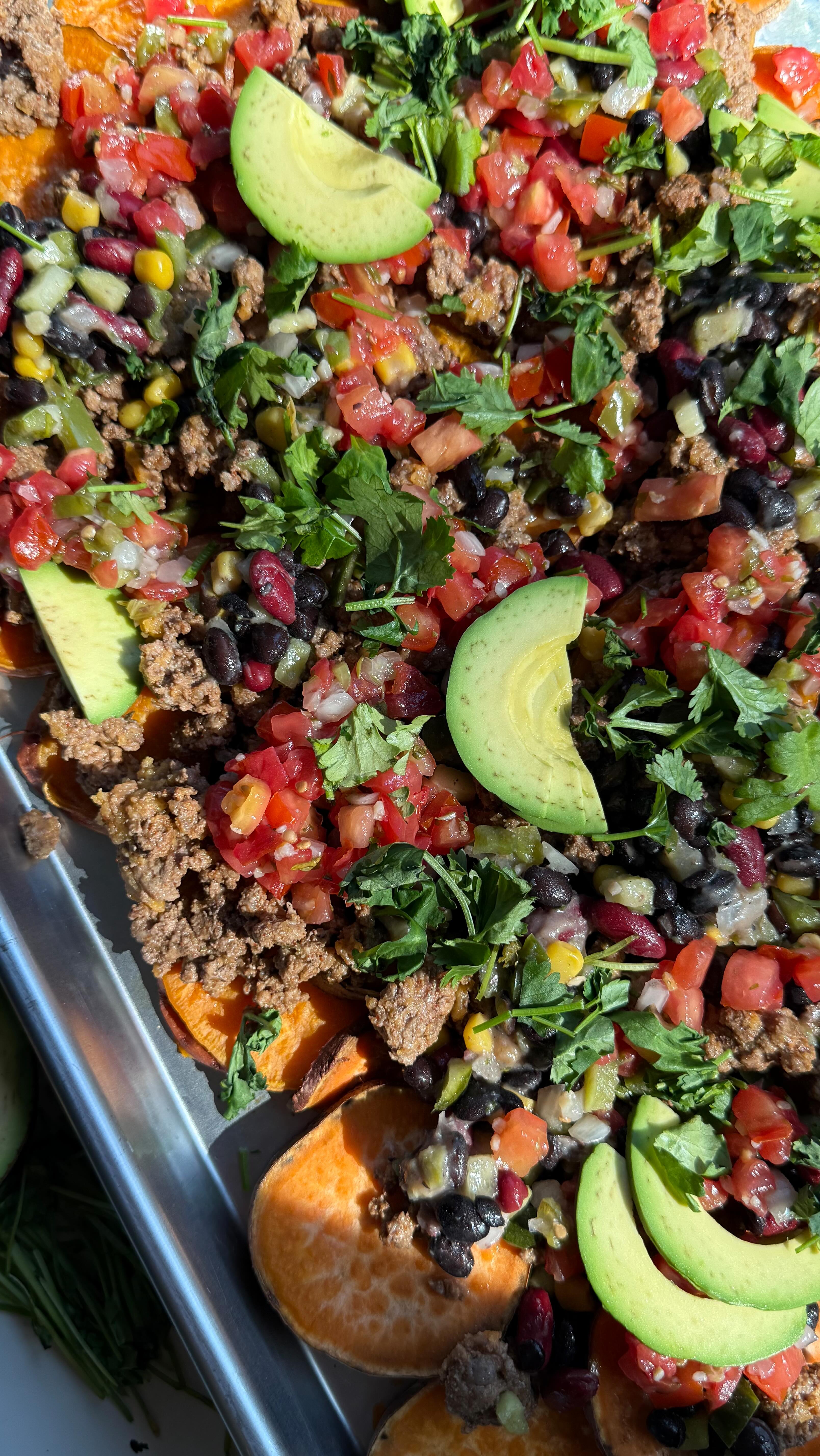 Instagram post by @jennaliveswell for Hungryroot. Caption reads: These Loaded Sheet Pan Sweet Potato Nachos are on....