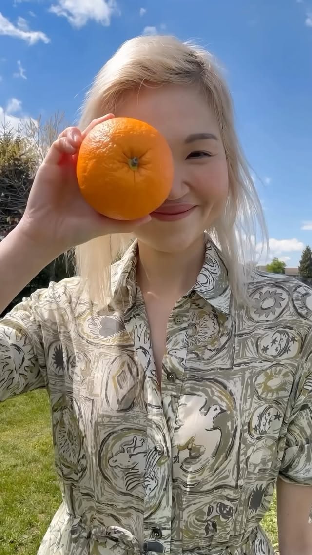 Instagram post by @april_waepril_beauty for Blume. Caption reads: Check out the NEW 𝐒𝐮𝐧𝐛𝐮𝐫𝐬𝐭 by @blume 🍊🧡....
