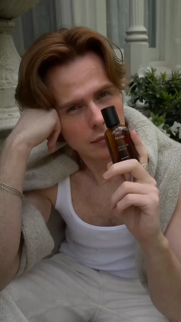 Instagram post by @louiburke for Aesop. Caption reads: This @aesop fragrance, Above Us Steorra, has....