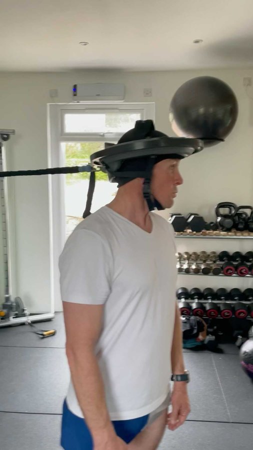 Instagram post by @andrew_cotty for Iron Neck. Caption reads: [...] rehab and train my neck and found....