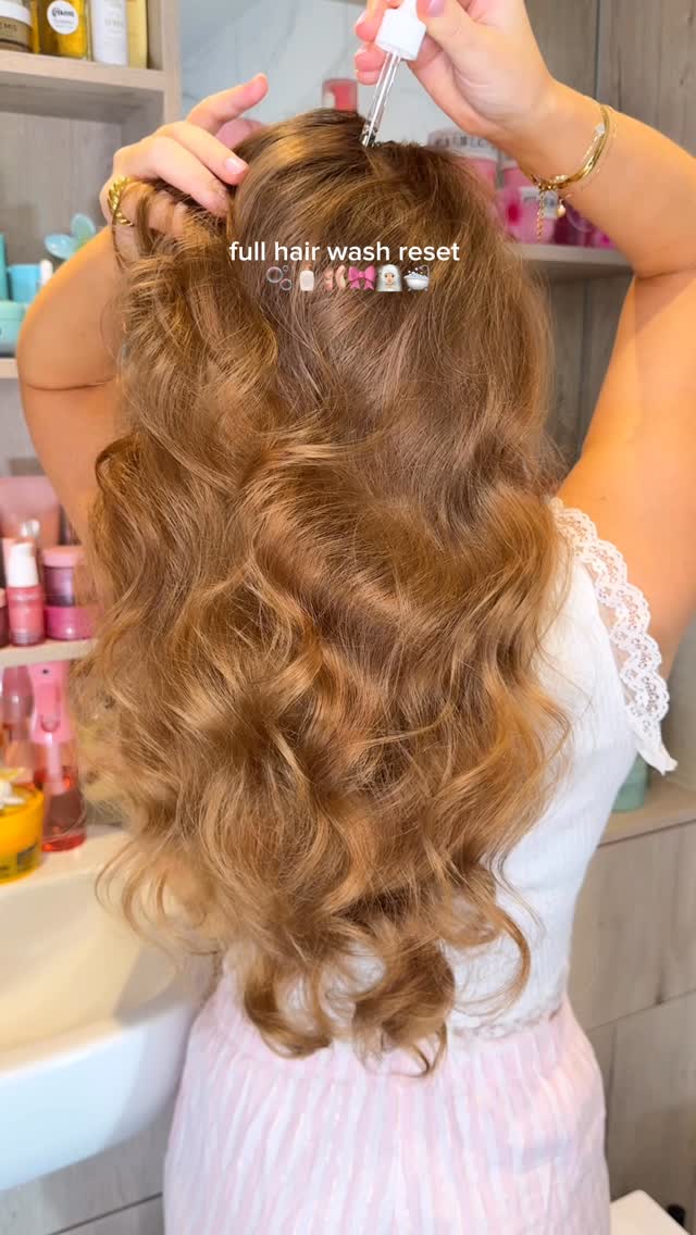 Instagram post by @byemmaleah for Biolage. Caption reads: full hair wash reset day....