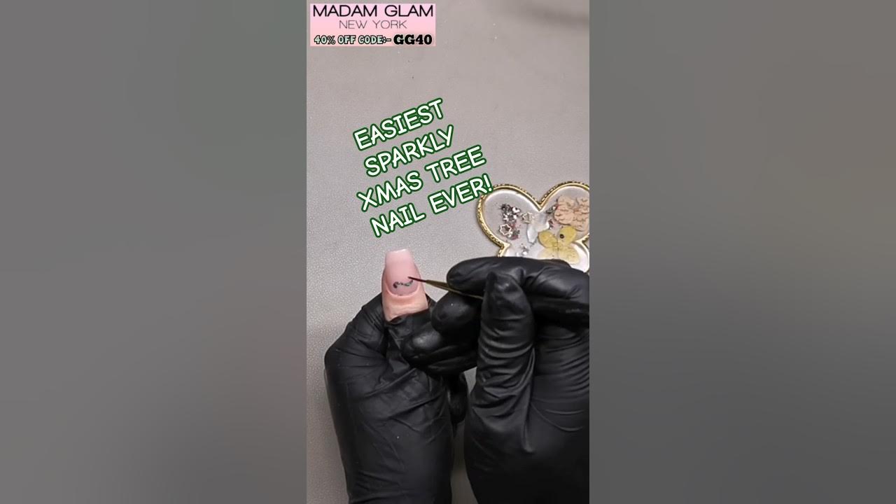 YouTube post by @NAILSWITHGG for Madam Glam. Caption reads: [...] nail art design ever, Ft. @madamglamofficial....