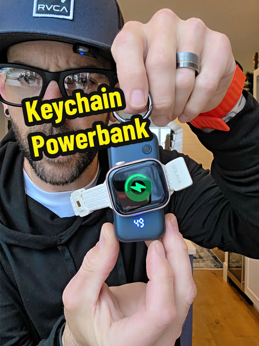 TikTok post by @theghousefam for INIU Shop. Caption reads: INIU Keychain Powerbank charges your smartwatch....
