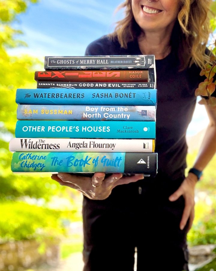 Instagram post by @suethebookie for Putnam Books. Caption reads: I’m already over halfway through this stack of new....