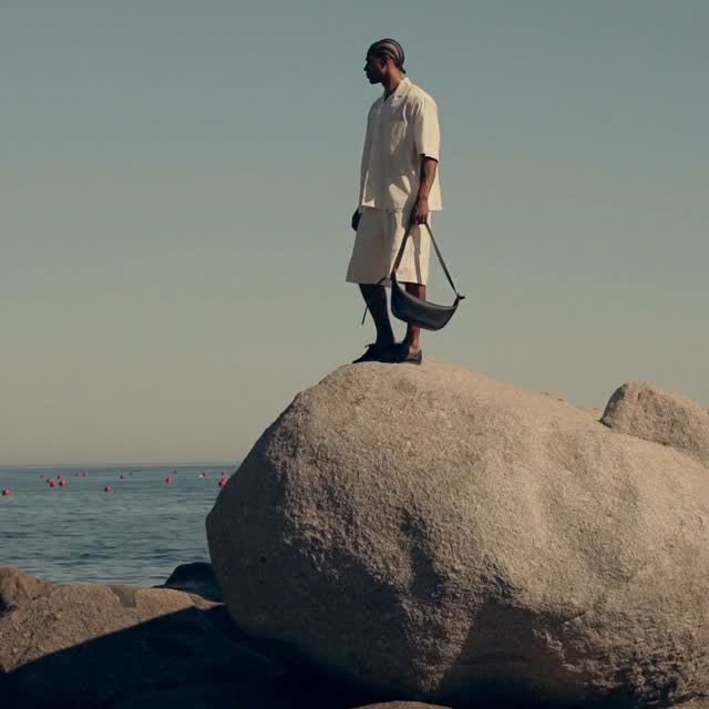 Instagram post by @jorgejavier_diaz for FARFETCH. Caption reads: Weekend getaway w/ @farfetch in one of my fav....