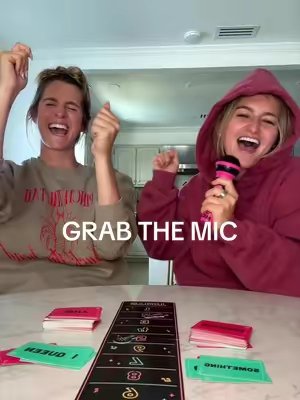 TikTok post by @calleyandmeg for Lucky Egg. Caption reads: GRAB THE MIC @Lucky Egg #grabthemic #calleyandmeg....