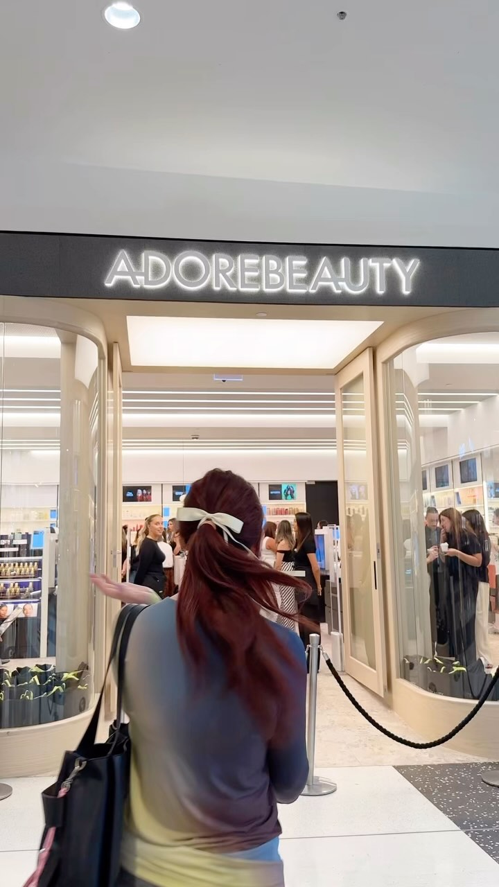 Instagram post by @hannahcollingwoodenglish for Adore Beauty. Caption reads: Who’s running to the @adorebeauty Westfield....