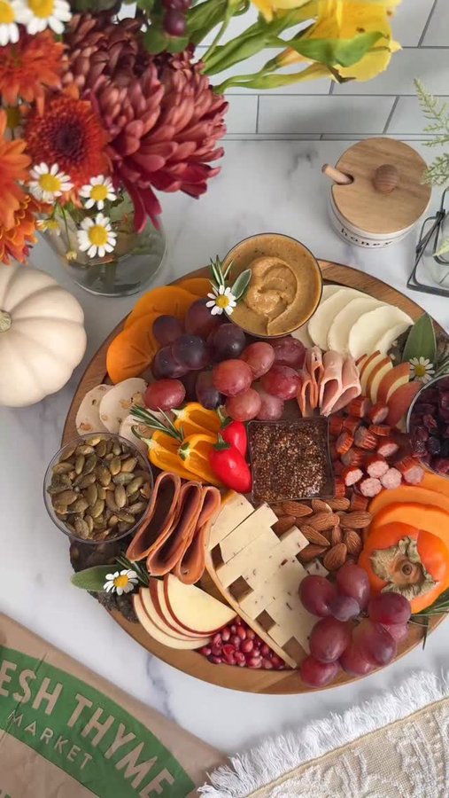 Instagram post by @theboardloon for Fresh Thyme. Caption reads: [...] ultimate Guilt-Free Gather Board with....