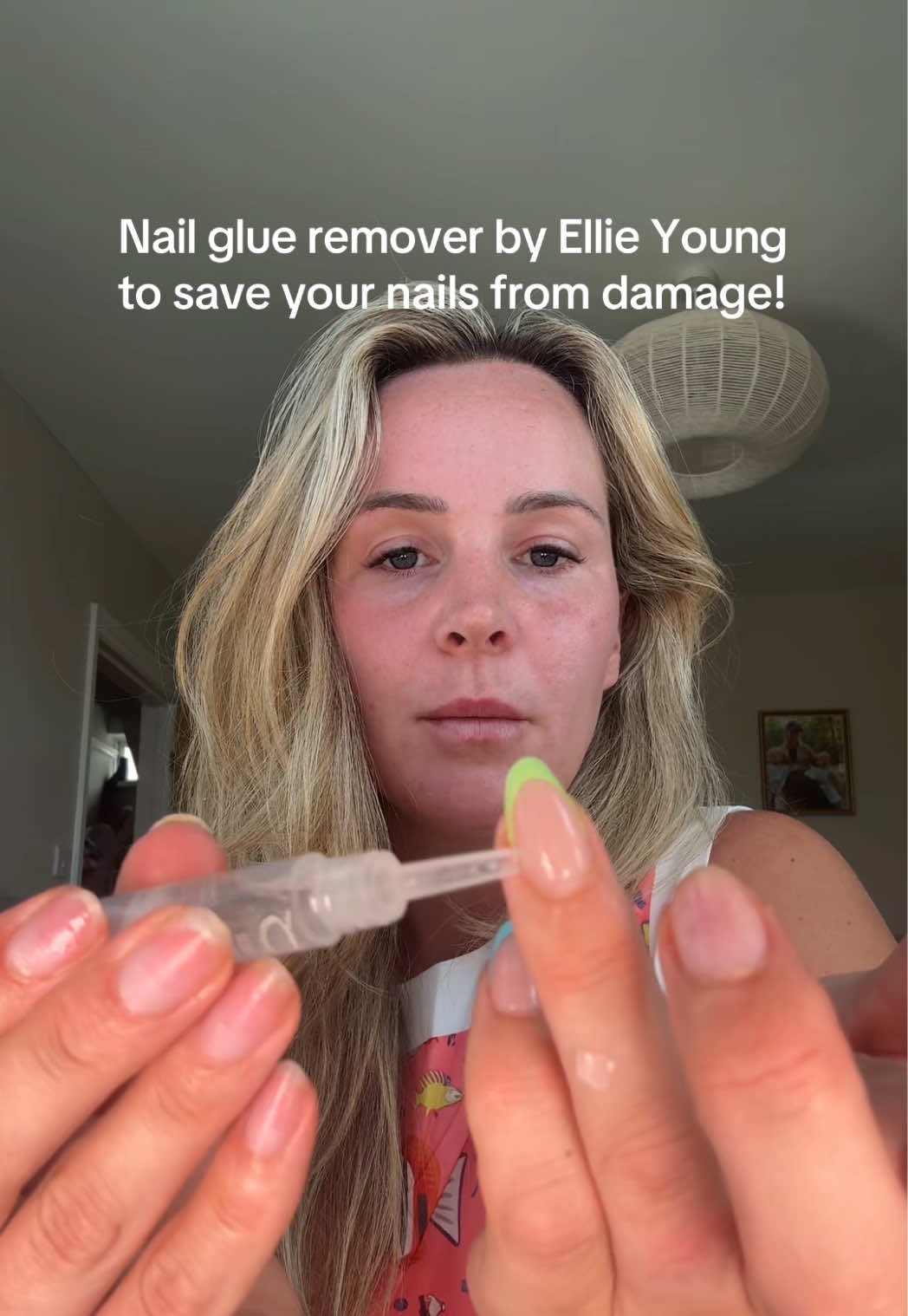 TikTok post by @emmatwinmum for Ellie Young Beauty Shop. Caption reads: How I remove the @Ellie Young Nails Ltd press on....