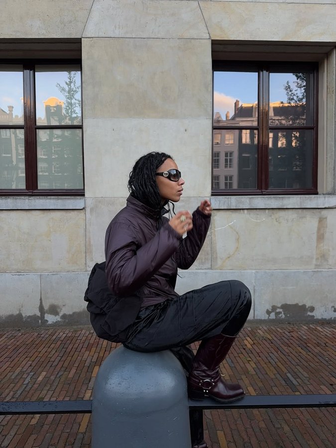 Instagram post by @fiahamelijnck for Rains. Caption reads: [...] trend prediction, living in Amsterdam.....