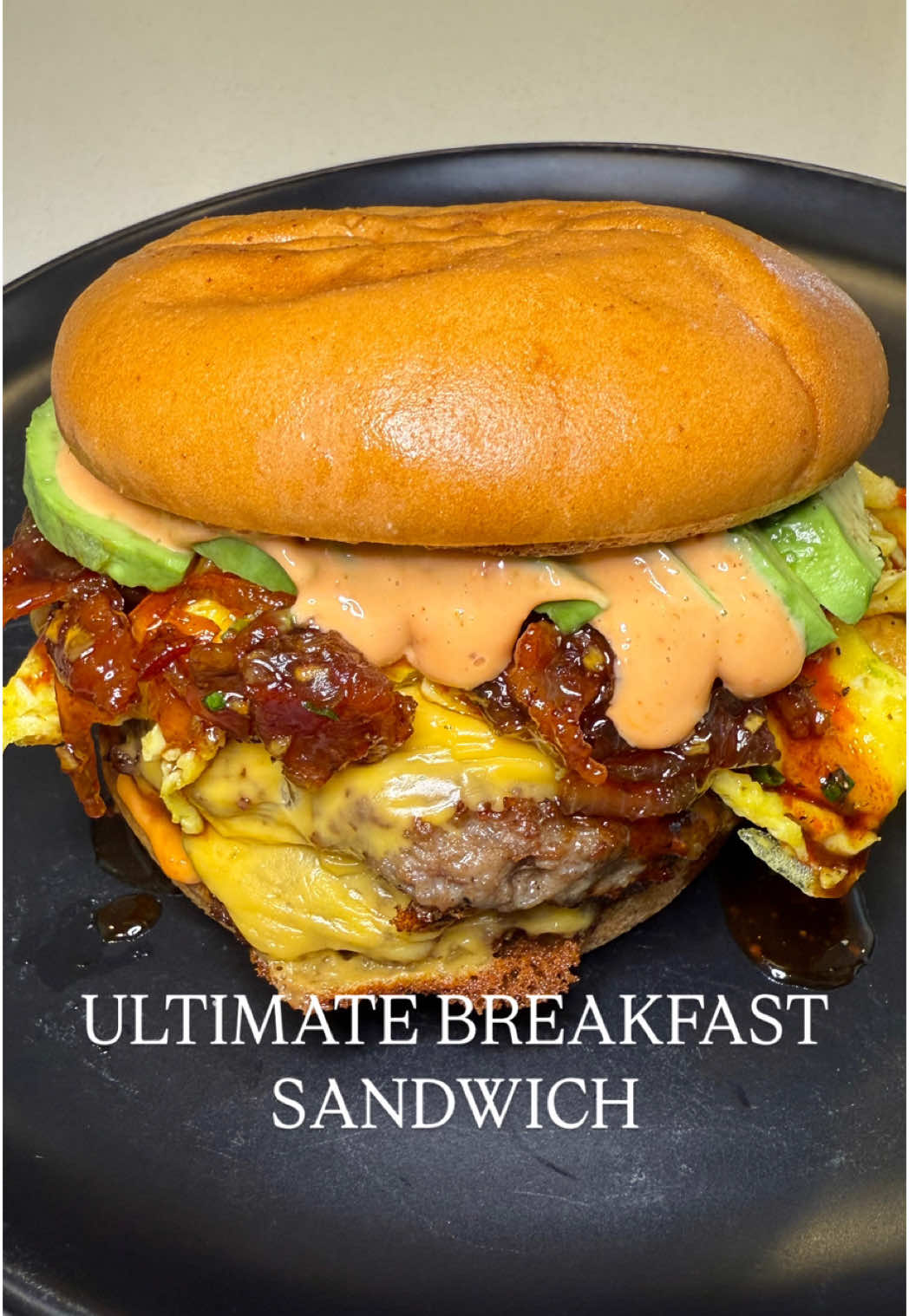 TikTok post by @alexrioscooks for Truff. Caption reads: [...] Breakfast Smashburger 🍔🍳🥓 recipe ⬇️....