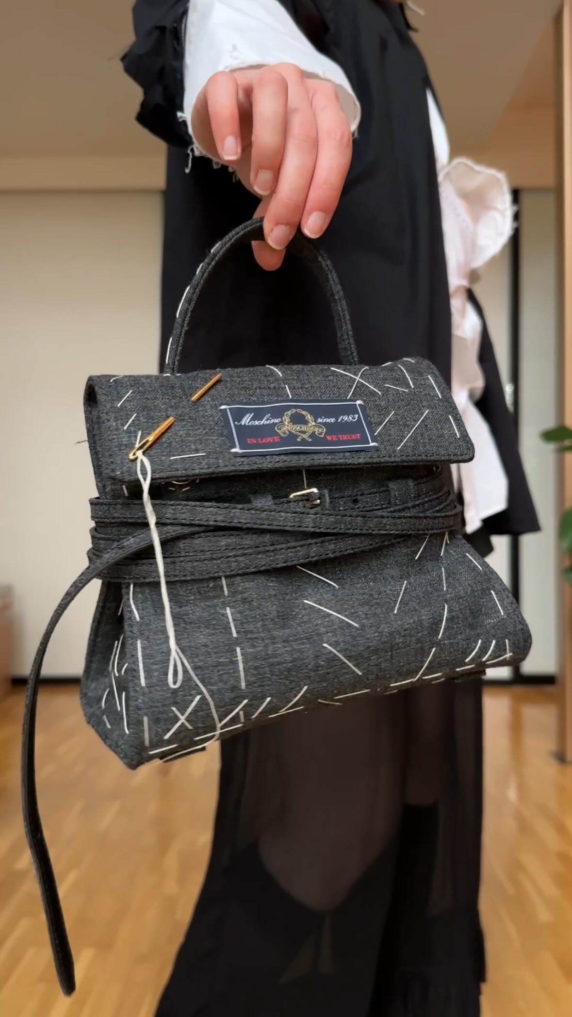 Instagram post by @alinarolling for Moschino. Caption reads: Mainos/ad/ Okay, but I’m really in love with this....