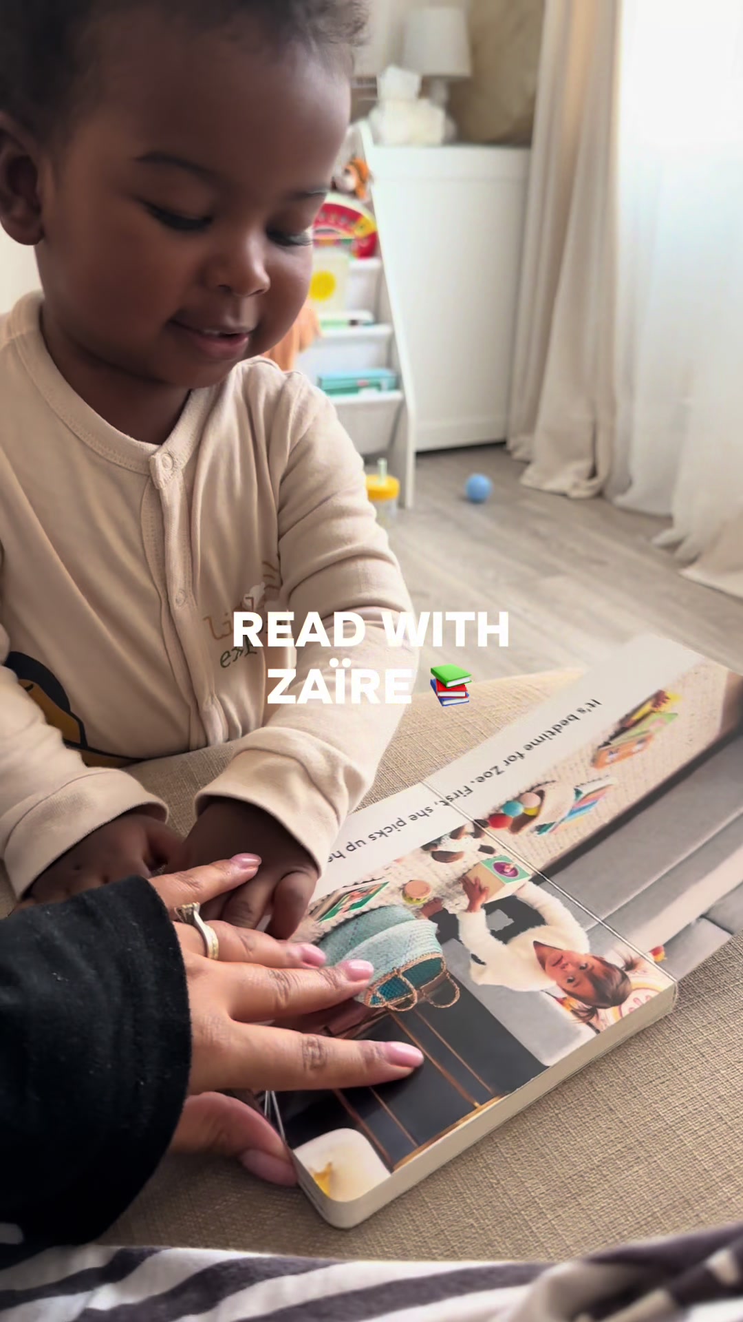 TikTok post by @veeneestanicole for Lovevery. Caption reads: Teaching our 1 year old to fall in love with....