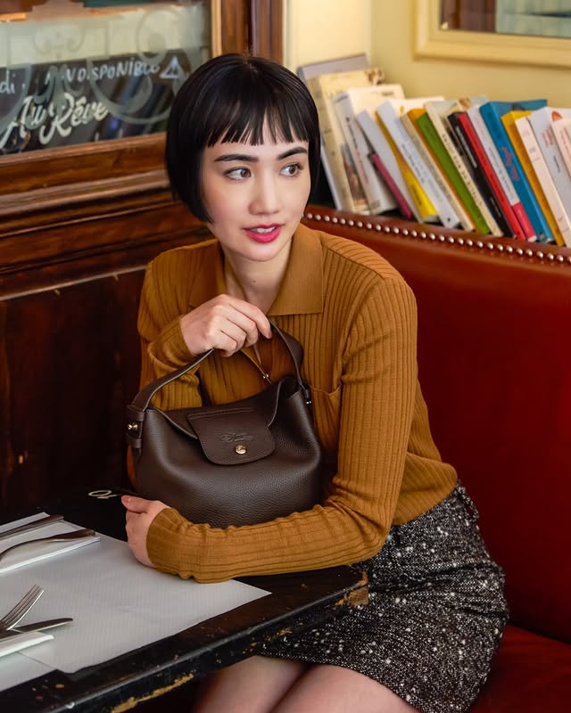 Instagram post by @foxco_kaori for LONGCHAMP. Caption reads: Wandering Paris with @longchamp 🇫🇷🥐🥖....