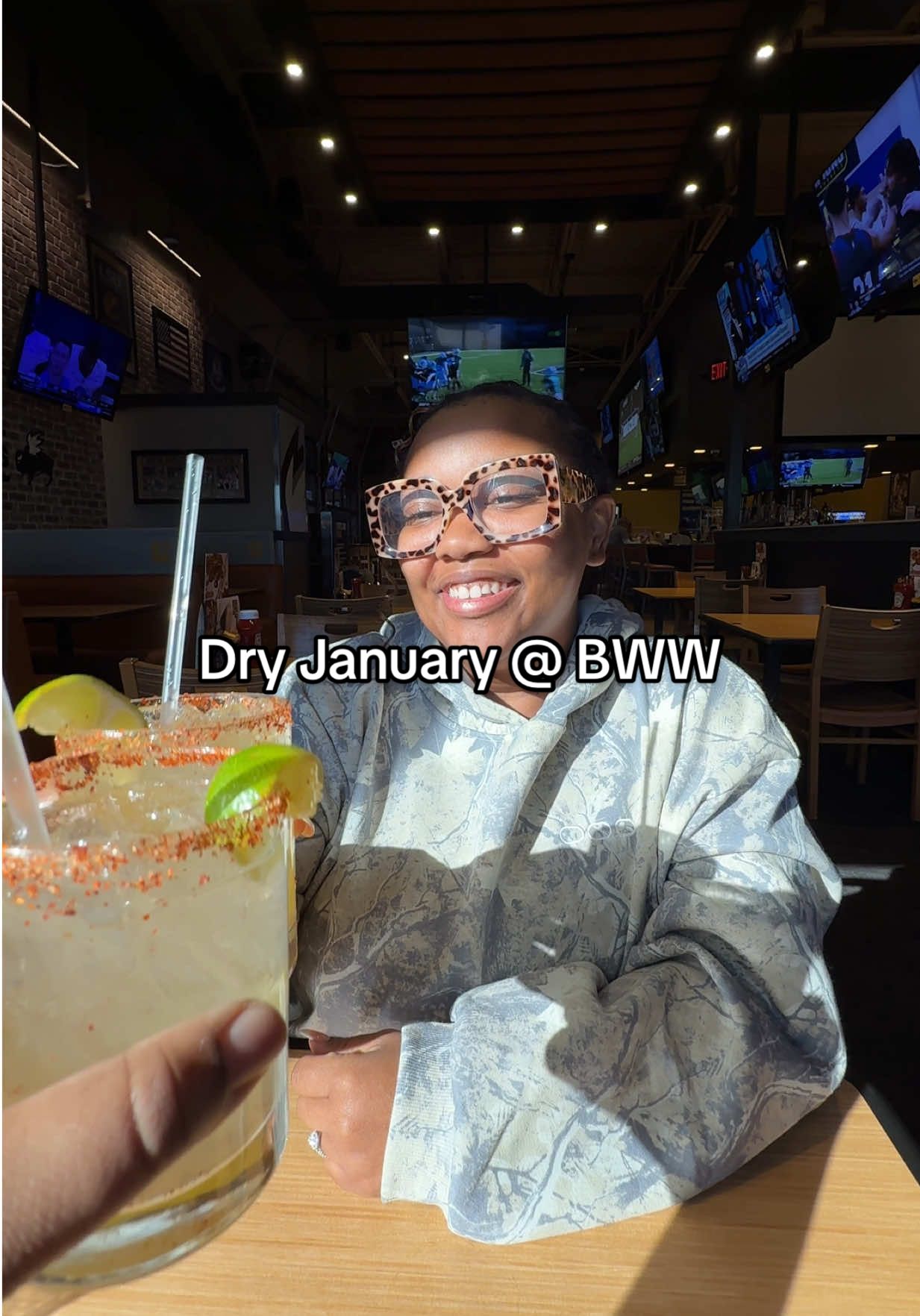 TikTok post by @hollyandrob_ for Buffalo Wild Wings. Caption reads: [...] just got 10x better thanks to @Buffalo Wild....