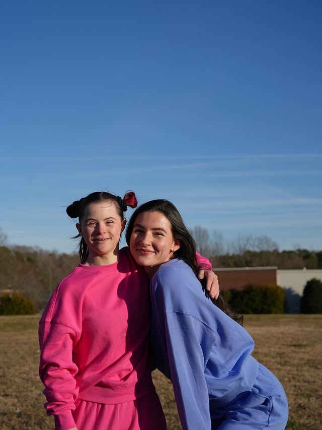 Instagram post by @vallitfit for Buffbunny Collection. Caption reads: Just sisters doing sister things (and pretending....