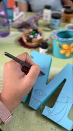 Instagram post by @theyellowbrush.studio for Diageo. Caption reads: We painted 32 personalised letters for the....