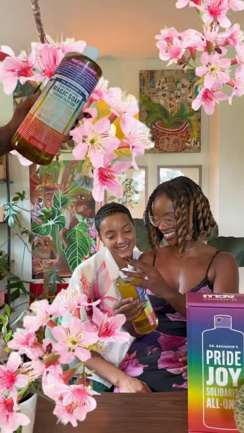 Instagram post by @blossomeffect_ for Dr. Bronner's. Caption reads: [...] Cherry Blossom Pride label. 💖🌿....