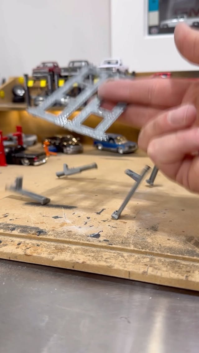 Instagram post by @streettruckdiecast for BendPak. Caption reads: Back on the @bendpak HD-9SW super wide hoist.....